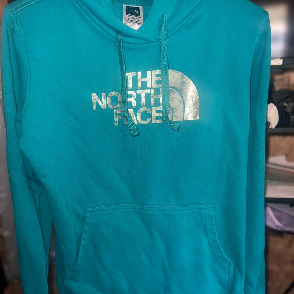 The North Face Turquoise Hoodie with Silver Logo